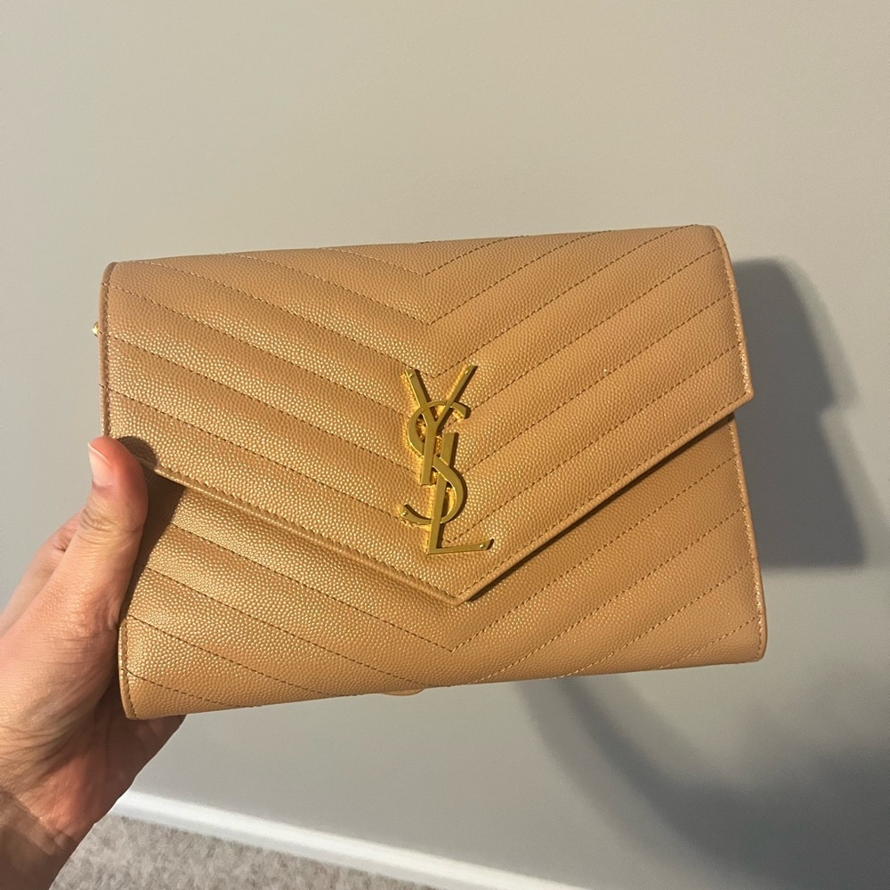 Saint Laurent 
Monogramme quilted textured-leather pouch in peach
